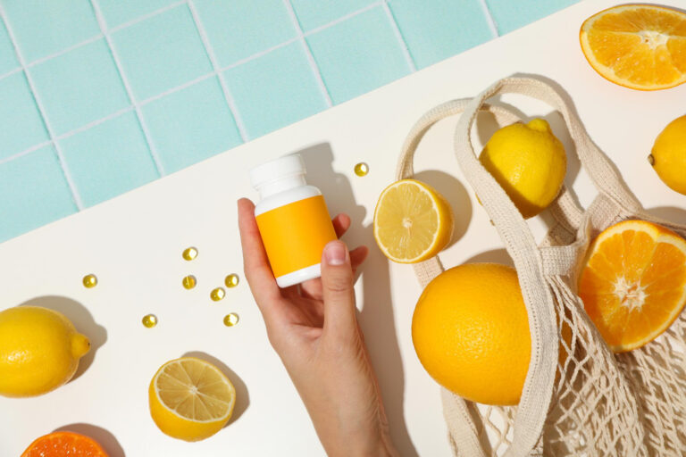 Biosupplement vitamin c in tablets on a light background