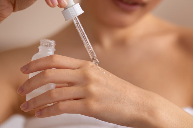 Front view woman using serum